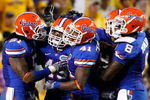 BATON ROUGE, LA - OCTOBER 10:  The defense of Florida Gators celebrate a stop against the Louisiana State University Tigers at Tiger Stadium on October 10, 2009 in Baton Rouge, Louisiana.  (Photo by Kevin C. Cox/Getty Images)