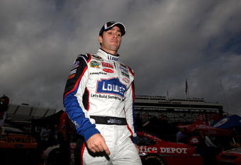 MARTINSVILLE, VA - OCTOBER 23:  Jimmie Johnson, driver of the #48 Lowe's Chevrolet, walks in the garage area prior to practice for the NASCAR Sprint Cup Series TUMS Fast Relief 500 at Martinsville Speedway on October 23, 2009 in Martinsville, Virginia.  (Photo by Streeter Lecka/Getty Images)