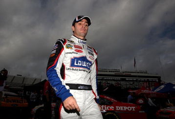 MARTINSVILLE, VA - OCTOBER 23:  Jimmie Johnson, driver of the #48 Lowe's Chevrolet, walks in the garage area prior to practice for the NASCAR Sprint Cup Series TUMS Fast Relief 500 at Martinsville Speedway on October 23, 2009 in Martinsville, Virginia.  (Photo by Streeter Lecka/Getty Images)