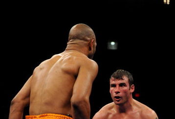 NEW YORK - NOVEMBER 08:  Joe Calzaghe of Wales (R) stares down Roy Jones Jr (L) during their Ring Magazine Light Heavyweight Championship bout at Madison Square Garden November 8, 2008 in New York City.  (Photo by Al Bello/Getty Images)