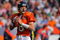 DENVER - OCTOBER 04:  Quarterback Kyle Orton #8 of the Denver Broncos drops back to pass against the Dallas Cowboys during NFL action at Invesco Field at Mile High on October 4, 2009 in Denver, Colorado. The Broncos defeated the Cowboys 17-10.  (Photo by Doug Pensinger/Getty Images)