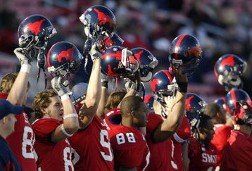 DALLAS - NOVEMBER 29:  Members of the Southern Methodist University Mustangs cheer the start of the second half against the Texas Christian University Horned Frogs despite looking at an 0-11 season November 29, 2003 at Gerald J. Ford Stadium in Dallas, Texas.  TCU won 20-13.  (Photo by Brian Bahr/Getty Images)