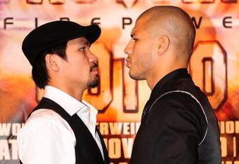 BEVERLY HILLS, CA - SEPTEMBER 14:  Manny Pacquiao and  Miguel Cotto pose for pictures during the press conference at the Beverly Hills Hotel on September 14, 2009 in Beverly Hills, California.  (Photo by Jacob de Golish/Getty Images)