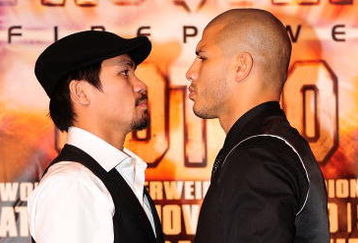 BEVERLY HILLS, CA - SEPTEMBER 14:  Manny Pacquiao and  Miguel Cotto pose for pictures during the press conference at the Beverly Hills Hotel on September 14, 2009 in Beverly Hills, California.  (Photo by Jacob de Golish/Getty Images)