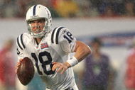 MIAMI GARDENS, FL - FEBRUARY 04:  Quarterback Peyton Manning #18 of the Indianapolis Colts scrambles with the ball during Super Bowl XLI against the Chicago Bears on February 4, 2007 at Dolphin Stadium in Miami Gardens, Florida. The Colts defeated the Bears 29-17. (Photo by Jonathan Daniel/Getty Images)