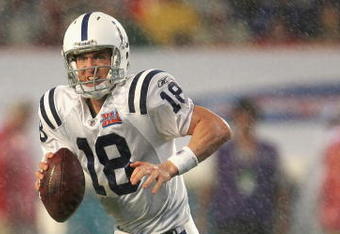 MIAMI GARDENS, FL - FEBRUARY 04:  Quarterback Peyton Manning #18 of the Indianapolis Colts scrambles with the ball during Super Bowl XLI against the Chicago Bears on February 4, 2007 at Dolphin Stadium in Miami Gardens, Florida. The Colts defeated the Bears 29-17. (Photo by Jonathan Daniel/Getty Images)