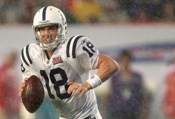 MIAMI GARDENS, FL - FEBRUARY 04:  Quarterback Peyton Manning #18 of the Indianapolis Colts scrambles with the ball during Super Bowl XLI against the Chicago Bears on February 4, 2007 at Dolphin Stadium in Miami Gardens, Florida. The Colts defeated the Bears 29-17. (Photo by Jonathan Daniel/Getty Images)