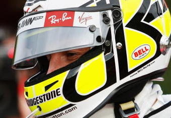 LONDON, ENGLAND - OCTOBER 20:  New Formula One World Champion Jenson Button of Great Britain and Brawn GP prepares to take competition winners for a drive following a Virgin Media's SpeedWeek50 photocall at Bluewater Shopping Centre on October 20, 2009 in London, England.  (Photo by Paul Gilham/Getty Images)