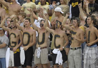 ORLANDO, FL - OCTOBER 20: Fans of the University of Central Florida Golden Knights cheer play against the Tulsa Golden Hurricane at Bright House Stadium on October 20, 2007 in Orlando, Florida.  UCF won 44 - 23. (Photo by Al Messerschmidt/Getty Images)