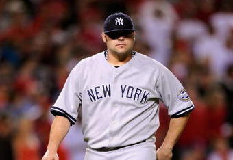 ANAHEIM, CA - OCTOBER 22:  Joba Chamberlain #62 of the New York Yankees leaves the mound after being relieved by teammate Mariano Rivera #42 (Not Shown) during the eight inning in Game Five of the ALCS against the Los Angeles Angels of Anaheim during the 2009 MLB Playoffs at Angel Stadium on October 22, 2009 in Anaheim, California.  (Photo by Kevork Djansezian/Getty Images)