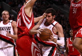PORTLAND, OR - APRIL 28:  Rudy Fernandez #5 of the Portland Trail Blazers drives against Yao Ming #11 and Shane Battier #31 of the Houston Rockets during Game 5 of the Western Conference Quarterfinals of the NBA Playoffs on April 28, 2009 at the Rose Garden in Portland, Oregon. NOTE TO USER: User expressly acknowledges and agrees that, by downloading and or using this Photograph, user is consenting to the terms and conditions of the Getty Images License Agreement.  (Photo by Jonathan Ferrey/Getty Images)