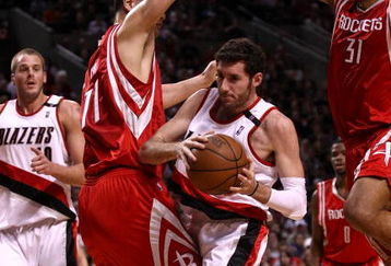 PORTLAND, OR - APRIL 28:  Rudy Fernandez #5 of the Portland Trail Blazers drives against Yao Ming #11 and Shane Battier #31 of the Houston Rockets during Game 5 of the Western Conference Quarterfinals of the NBA Playoffs on April 28, 2009 at the Rose Garden in Portland, Oregon. NOTE TO USER: User expressly acknowledges and agrees that, by downloading and or using this Photograph, user is consenting to the terms and conditions of the Getty Images License Agreement.  (Photo by Jonathan Ferrey/Getty Images)