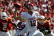 DALLAS - OCTOBER 17:  Quarterback Landry Jones #12 of the Oklahoma Sooners drops back to pass against the Texas Longhorns at Cotton Bowl on October 17, 2009 in Dallas, Texas.  (Photo by Ronald Martinez/Getty Images)