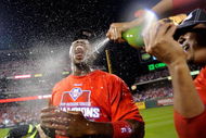 PHILADELPHIA - OCTOBER 21: Ryan Howard #6 of the Philadelphia Phillies is sprayed down with champagne by teammate Pedro Martinez #45 as they celebrate defeating the Los Angeles Dodgers 10-4 to advance to the World Series in Game Five of the NLCS during the 2009 MLB Playoffs at Citizens Bank Park on October 21, 2009 in Philadelphia, Pennsylvania. (Photo by Jeff Zelevansky/Getty Images)