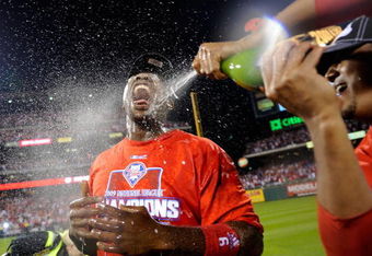 PHILADELPHIA - OCTOBER 21:  Ryan Howard #6 of the Philadelphia Phillies is sprayed down with champagne by teammate Pedro Martinez #45 as they  celebrate defeating the Los Angeles Dodgers 10-4 to advance to the World Series in Game Five of the NLCS during the 2009 MLB Playoffs at Citizens Bank Park on October 21, 2009 in Philadelphia, Pennsylvania.  (Photo by Jeff Zelevansky/Getty Images)