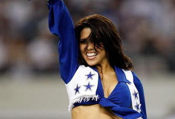 ARLINGTON, TX - SEPTEMBER 28:  A Dallas Cowboys Cheerleader performs at Cowboys Stadium on September 28, 2009 in Arlington, Texas.  (Photo by Ronald Martinez/Getty Images)