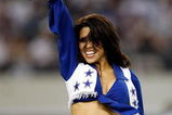 ARLINGTON, TX - SEPTEMBER 28:  A Dallas Cowboys Cheerleader performs at Cowboys Stadium on September 28, 2009 in Arlington, Texas.  (Photo by Ronald Martinez/Getty Images)