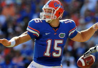 GAINESVILLE, FL - OCTOBER 17: Quarterback Tim Tebow #15 of the Florida Gators fumbles before passing in the first quarter against the University of Arkansas Razorbacks October 17, 2009 at Ben Hill Griffin Stadium in Gainesville, Florida.  (Photo by Al Messerschmidt/Getty Images)