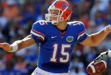 GAINESVILLE, FL - OCTOBER 17: Quarterback Tim Tebow #15 of the Florida Gators fumbles before passing in the first quarter against the University of Arkansas Razorbacks October 17, 2009 at Ben Hill Griffin Stadium in Gainesville, Florida.  (Photo by Al Messerschmidt/Getty Images)