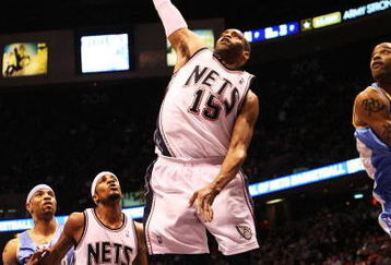 EAST RUTHERFORD, NJ - MARCH 21:  Vince Carter #15 of the New Jersey Nets dunks against the Denver Nuggets during their game on March 21, 2008 at the Izod Arena in East Rutherford, New Jersey.  Photo By Al Bello/Getty Images.  NOTE TO USER: User expressly acknowledges and agrees that, by downloading and/or using this Photograph, user is consenting to the terms and conditions of the Getty Images License Agreement.  (Photo by Al Bello/Getty Images)