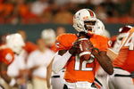 MIAMI GARDENS, FL - OCTOBER 03:  Quarterback Jacory Harris #12 of the Miami Hurricanes drops back to pass against the Oklahoma Sooners at Land Shark Stadium on October 3, 2009 in Miami Gardens, Florida. Miami defeated Oklahoma 21-20.  (Photo by Doug Benc/Getty Images)