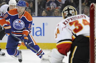EDMONTON, AB - OCTOBER 3: Center Patrick O'Sullivan #19 of the Edmonton Oilers skates towards goalie Miikka Kiprusoff #34 of the Calgary Flames in a game between the Calgary Flames and the Edmonton Oilers during an NHL game on October 3, 2009 at Rexall Arena in Edmonton, Canada. The Flames defeated the Oilers 4-3. (Photo by Jimmy Jeong/Getty Images)