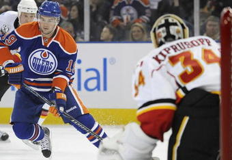 EDMONTON, AB - OCTOBER 3: Center Patrick O'Sullivan #19 of the Edmonton Oilers skates towards goalie Miikka Kiprusoff #34 of the Calgary Flames in a game between the Calgary Flames and the Edmonton Oilers during an NHL game on October 3, 2009 at Rexall Arena in Edmonton, Canada. The Flames defeated the Oilers 4-3. (Photo by Jimmy Jeong/Getty Images)