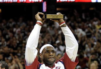 CLEVELAND - MAY 05:  LeBron James #23 of the Cleveland Cavaliers holds up the 2008-2009 MVP trophy prior playing the Atlanta Hawks in Game One of the Eastern Conference Semifinals during the 2009 NBA Playoffs at Quicken Loans Arena on May 5, 2009 in Cleveland, Ohio.  NOTE TO USER: User expressly acknowledges and agrees that, by downloading and or using this photograph, User is consenting to the terms and conditions of the Getty Images License Agreement.  (Photo by Gregory Shamus/Getty Images)