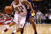 EAST RUTHERFORD, NJ - MARCH 27:  Devin Harris #34 of the New Jersey Nets drives against Derek Fisher #2 of the Los Angeles Lakers during the game on March 27, 2009 at the Izod Center in East Rutherford, New Jersey. NOTE TO USER: User expressly acknowledges and agrees that, by downloading and/or using this Photograph, User is consenting to the terms and conditions of the Getty Images License Agreement.  (Photo by Chris McGrath/Getty Images)