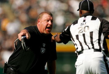 OAKLAND, CA - SEPTEMBER 27:  Oakland Raiders head coach Tom Cable argues with side judge Barry Anderson during their game against the Denver Broncos at the Oakland-Alameda County Coliseum on September 27, 2009 in Oakland, California.  (Photo by Ezra Shaw/Getty Images)