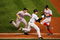 NEW YORK - OCTOBER 19:  Pitcher Bronson Arroyo #61 of the Boston Red Sox has the ball knocked out of his glove by batter Alex Rodriguez #13 of the New York Yankees on a tag-out at first base as first baseman Kevin Millar #15 looks on in the eighth inning during game six of the American League Championship Series on October 19, 2004 at Yankee Stadium in the Bronx borough of New York City. (Photo by Jed Jacobsohn/Getty Images)