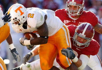 TUSCALOOSA, AL - OCTOBER 24:  Cory Reamer #13 of the Alabama Crimson Tide tackles Montario Hardesty #2 of the Tennessee Volunteers at Bryant-Denny Stadium on October 24, 2009 in Tuscaloosa, Alabama.  (Photo by Kevin C. Cox/Getty Images)