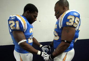 SAN DIEGO, CA - OCTOBER 19:  Runningback LaDainian Tomlinson #21 and Fullback Mike Tolbert #35 of the San Diego Chargers pray before the start of the game against the Denver Broncos during Monday Night Football on October 19, 2009 at Qualcomm Stadium in San Diego, California. (Photo by Donald Miralle/Getty Images)
