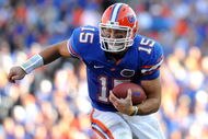GAINESVILLE, FL - OCTOBER 17: Quarterback Tim Tebow #15 of the Florida Gators rushes upfield against the University of Arkansas Razorbacks October 17, 2009 at Ben Hill Griffin Stadium in Gainesville, Florida.  (Photo by Al Messerschmidt/Getty Images)