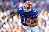 GAINESVILLE, FL - OCTOBER 17: Quarterback Tim Tebow #15 of the Florida Gators rushes upfield against the University of Arkansas Razorbacks October 17, 2009 at Ben Hill Griffin Stadium in Gainesville, Florida.  (Photo by Al Messerschmidt/Getty Images)