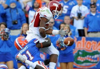 GAINESVILLE, FL - OCTOBER 17: Wide receiver Greg Childs #85 of the Arkansas Razorbacks fumbles at the goal line against the Florida Gators October 17, 2009 at Ben Hill Griffin Stadium in Gainesville, Florida.  The play was ruled a touchdown. (Photo by Al Messerschmidt/Getty Images)