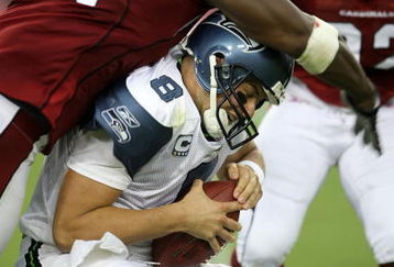 GLENDALE, AZ - SEPTEMBER 16:  Defensive end Antonio Smith #94 of the Arizona Cardinals sacks quarterback Matt Hasselbeck #8 of the Seattle Seahawks at University of Phoenix Stadium September 16, 2007 in Glendale, Arizona.  (Photo by Stephen Dunn/Getty Images)