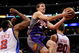 LOS ANGELES, CA - FEBRUARY 18:  Goran Dragic #2 of the Phoenix Suns drives to the basket in between scores against Fred Jones #2  and Steve Novak #20 of the Los Angeles Clippers at the Staples Center on February 18, 2009 in Los Angeles, California.  NOTE TO USER: User expressly acknowledges and agrees that, by downloading and or using this photograph, User is consenting to the terms and conditions of the Getty Images License Agreement.  (Photo by Kevork Djansezian/Getty Images)