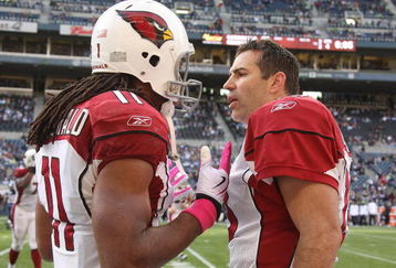SEATTLE - OCTOBER 18: Quarterback Kurt Warner #13 (R) of the Arizona Cardinals exchanges words with wide receiver Larry Fitzgerald #11during the game against the Seattle Seahawks on October 18, 2009 at Qwest Field in Seattle, Washington. (Photo by Otto Greule Jr/Getty Images)