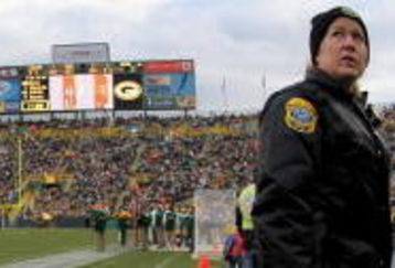 GREEN BAY, WI - NOVEMBER 16:  A Green Bay police officer stands guard on the field as the Chicago Bears face the Green Bay Packers during NFL action at Lambeau Field on November 16, 2008 in Green Bay, Wisconsin. The Packers defeated the Bears 37-3.  (Photo by Doug Pensinger/Getty Images)