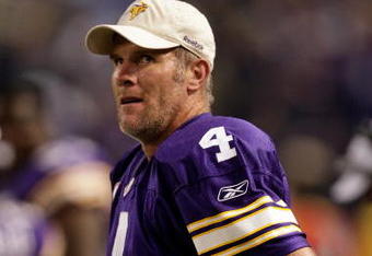 MINNEAPOLIS - OCTOBER 05:  Quarterback Brett Favre #4 of the Minnesota Vikings watches the reply from the sidelines after a touchdown during the game against the Green Bay Packers on October 5, 2009 at Hubert H. Humphrey Metrodome in Minneapolis, Minnesota.  (Photo by Jamie Squire/Getty Images)