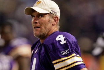 MINNEAPOLIS - OCTOBER 05:  Quarterback Brett Favre #4 of the Minnesota Vikings watches the reply from the sidelines after a touchdown during the game against the Green Bay Packers on October 5, 2009 at Hubert H. Humphrey Metrodome in Minneapolis, Minnesota.  (Photo by Jamie Squire/Getty Images)