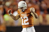 AUSTIN, TX - OCTOBER 10: Quarterback Colt McCoy #12 of the Texas Longhorns pumps his fists after throwing a touchdown pass to wide receiver Jordan Shipley in the minute before the half against the Colorado Buffaloes on October 10, 2009 at Darrell K Royal-Texas Memorial Stadium in Austin, Texas. Colorado leads 14-10. (Photo by Brian Bahr/Getty Images)