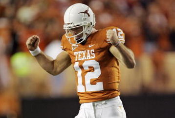 AUSTIN, TX - OCTOBER 10: Quarterback Colt McCoy #12 of the Texas Longhorns pumps his fists after throwing a touchdown pass to wide receiver Jordan Shipley in the minute before the half against the Colorado Buffaloes on October 10, 2009 at Darrell K Royal-Texas Memorial Stadium in Austin, Texas. Colorado leads 14-10. (Photo by Brian Bahr/Getty Images)
