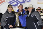 CONCORD, NC - OCTOBER 17:  (L-R) Jimmie Johnson, driver of the #48 Lowe's Chevrolet, celebrates with his crew chief Chad Knaus and team owner Rick Hendrick after winning the NASCAR Sprint Cup Series NASCAR Banking 500 at Lowe's Motor Speedway on October 17, 2009 in Concord, North Carolina.  (Photo by John Harrelson/Getty Images for NASCAR)