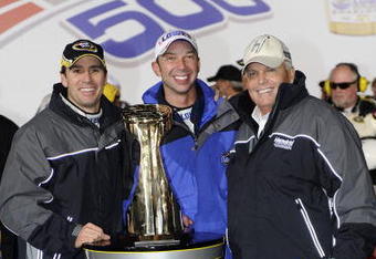 CONCORD, NC - OCTOBER 17:  (L-R) Jimmie Johnson, driver of the #48 Lowe's Chevrolet, celebrates with his crew chief Chad Knaus and team owner Rick Hendrick after winning the NASCAR Sprint Cup Series NASCAR Banking 500 at Lowe's Motor Speedway on October 17, 2009 in Concord, North Carolina.  (Photo by John Harrelson/Getty Images for NASCAR)