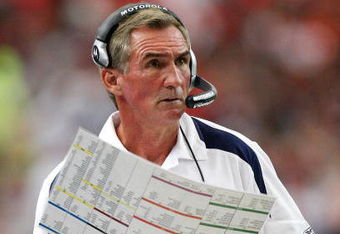 ATLANTA - NOVEMBER 16:  Head coach Mike Shanahan of the Denver Broncos looks at his playbook against the Atlanta Falcons during the game at the Georgia Dome on November 16, 2008 in Atlanta, Georgia.  (Photo by Kevin C. Cox/Getty Images)