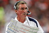 ATLANTA - NOVEMBER 16:  Head coach Mike Shanahan of the Denver Broncos looks at his playbook against the Atlanta Falcons during the game at the Georgia Dome on November 16, 2008 in Atlanta, Georgia.  (Photo by Kevin C. Cox/Getty Images)