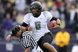 SEATTLE - OCTOBER 24:  Quarterback Jeremiah Masoli #8 of the Oregon Ducks rushes against Joshua Gage #24 of the Washington Huskies on October 24, 2009 at Husky Stadium in Seattle, Washington. The Ducks defeated the Huskies 43-19. (Photo by Otto Greule Jr/Getty Images)
