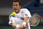 SHANGHAI, CHINA - OCTOBER 12:  Marat Safin of Russia returns a shot to Mao-Xin Gong of China during day two of 2009 Shanghai ATP Masters 1000 at the Qi Zhong Tennis Centre in Shanghai.  (Photo by Victor Fraile/Getty Images)